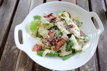 Caesar salad on wooden table