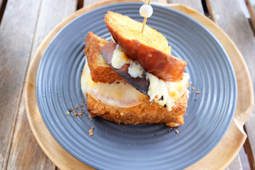 Ham cheese sandwich on wooden table