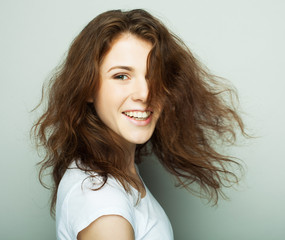 lifestyle and people concept: Young casual woman portrait. Clean face, curly hair. 