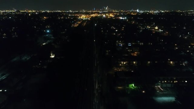 Night Aerial View Flying towards Philadelphia with Patco High Speed Line Train