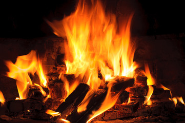 closeup of Flame in a fireplace, flames and burning woods