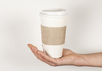 Paper cup of coffee on white background