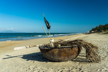 Basket Fishing Boat. Traditional Vietnamese basket fishing boat on a beach, Hoi An, Vietnam.
