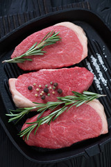 Closeup of raw seasoned beef medallion steaks, studio shot