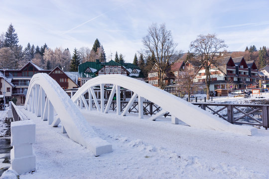 White bridge over Elbe river in winter, ski resort Spindleruv mlyn, Krkonose (Giant) mountains, Czech republic