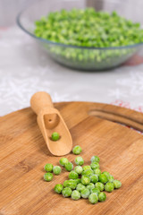 Green peas on the wooden board. Flat lay with copy space green p
