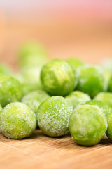 Frozen green peas with blurred background