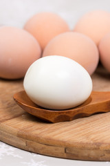 Boiled egg on the wooden holder