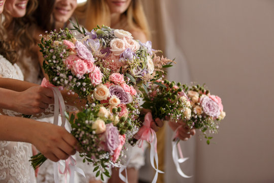 Bouquets of fresh flowers, girls holding beautiful bouquets at wedding day