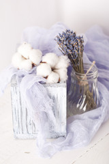 lavender and cotton with violet textile on white wooden table. s