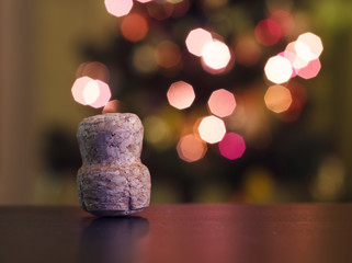 Champagne cork on a background of holiday lights.