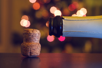 Champagne cork on a background of holiday lights.