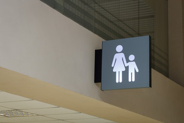sign of mother and child in the interior of the station