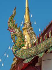 Fototapeta na wymiar Main church delicate Thai art on roof