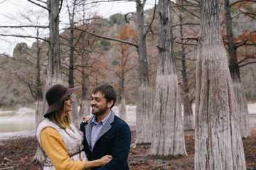 Fototapeta premium happy couple outdoor. hugging man and woman in park