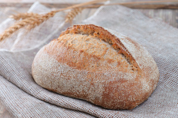 fresh loaf of bread on vintage table