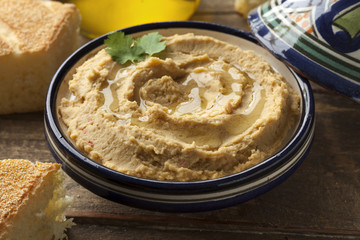Bowl with hummus and olive oil