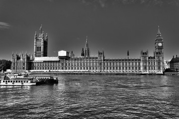 Looking across the Thames River towards the grand mock-Gothic architecture of the Palace of Westminster, London, England