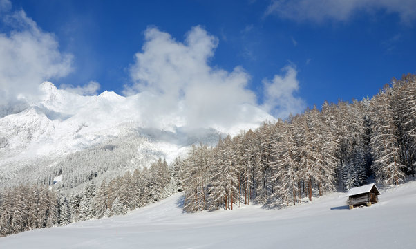 Old wooden hut an a sunny winter day in Tyrol, Austria