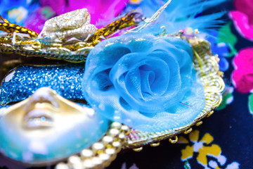 Blue carnival mask with glittering background Selective focus / Carnival Mask for festival Background / mask in store on street, Venice Italy.
