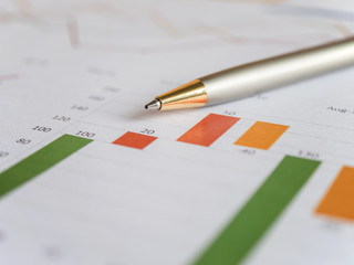 Close pen on business charts 2