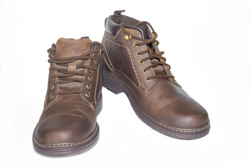Brown man's leather boots isolated on white background.