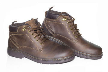 Brown man's leather boots isolated on white background.