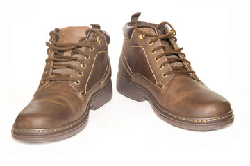 Brown man's leather boots isolated on white background.