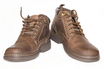 Brown man's leather boots isolated on white background.