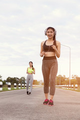 Fototapeta premium Young woman running at the park