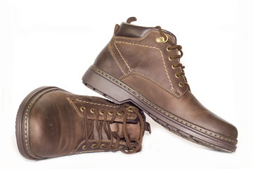 Brown man's leather boots isolated on white background.