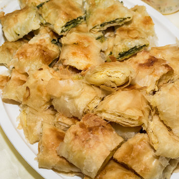 Traditional Serbian cheese pie gibanica and spinach pie in plate