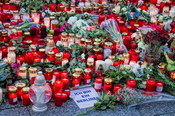 Fototapeta premium Candles and flowers for terror victims