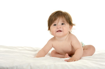 Baby girl lying on  blanket