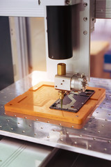 Robot holding glue syringe Injection on phone