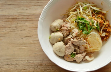 dried thin rice noodle with pork ball and boiled meat on bowl
