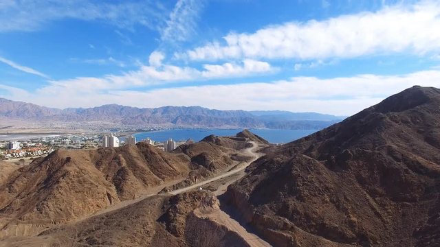 Eilat, Israel - Aerial footage over Solomon's mountains, revealing Eilat's skyline and the red sea