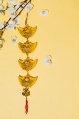 Chinese new year decoration items on yellow background.