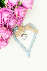 Valentines day fresh violet roses top view flat lay scene with heart