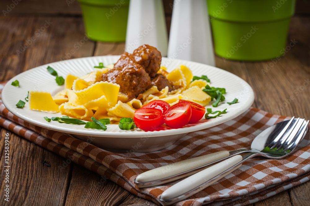 Canvas Prints tagliatelle, meatballs in dark sauce and tomato.