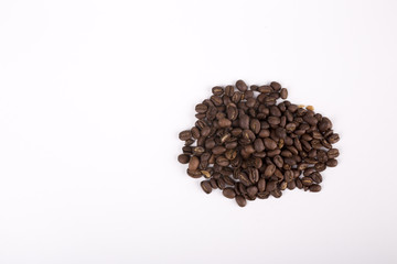 fresh roasted beans of coffe on white background