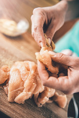 Woman Seasoning Meat