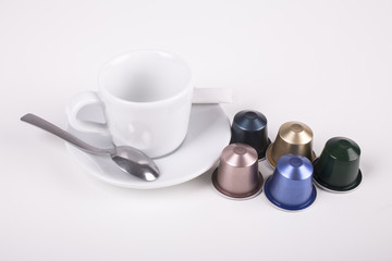 coffee cup with capsule and spoon