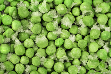 Close-up of frozen green peas with ice crystals. Food background