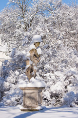 Naked lady statue covered in snow in Warsaw Lazienki park, after