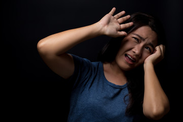 Screaming woman on black background