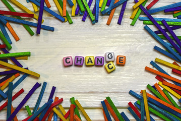 dice letters of Change and Chance word concept with framming colorful wood stick