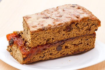 Fruit-Cake with raisins on a white plate