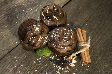 Chocolate cupcakes on wooden background
