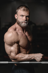 brutal muscular man with beard unshaven fitness model healthcare